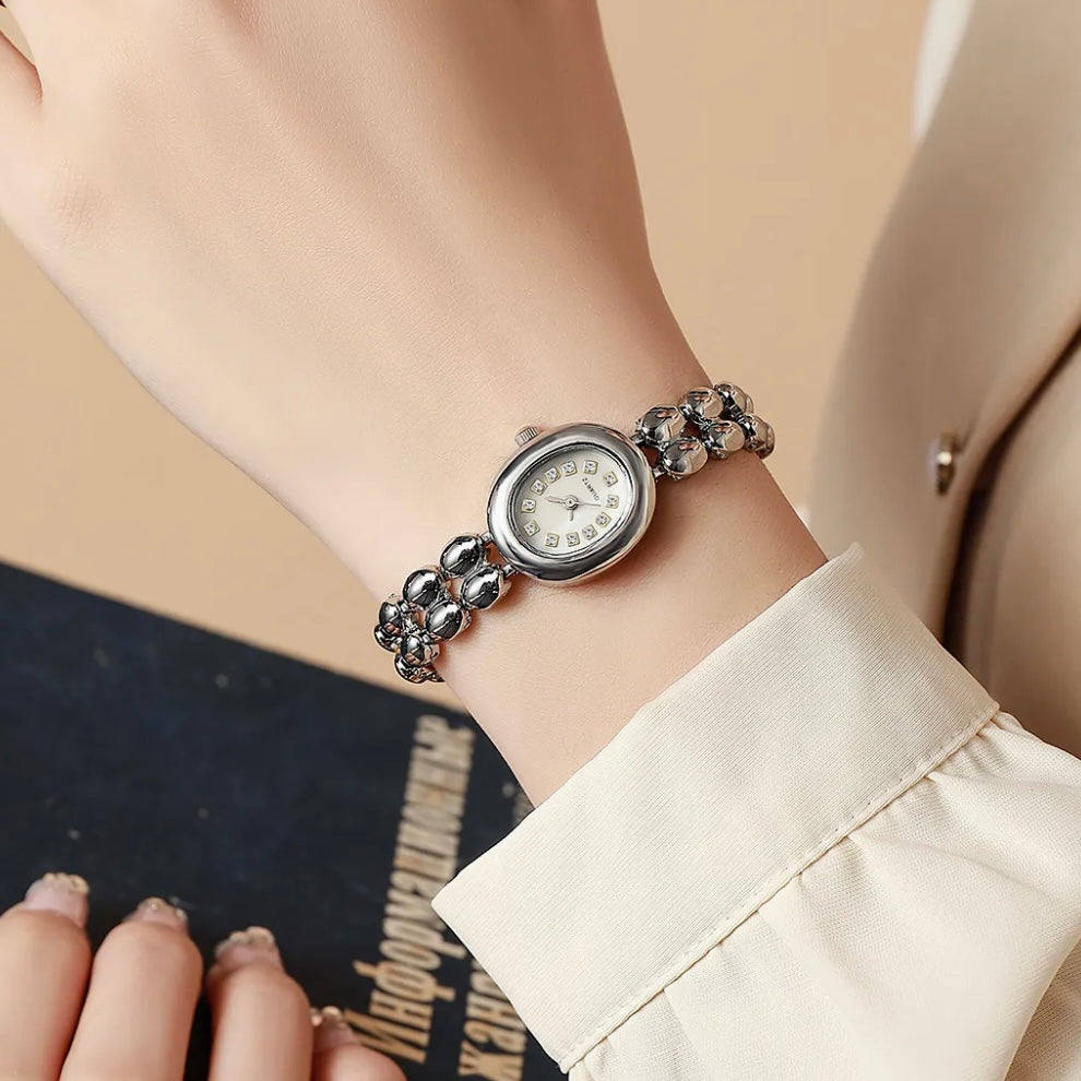 Silver oval grain watch