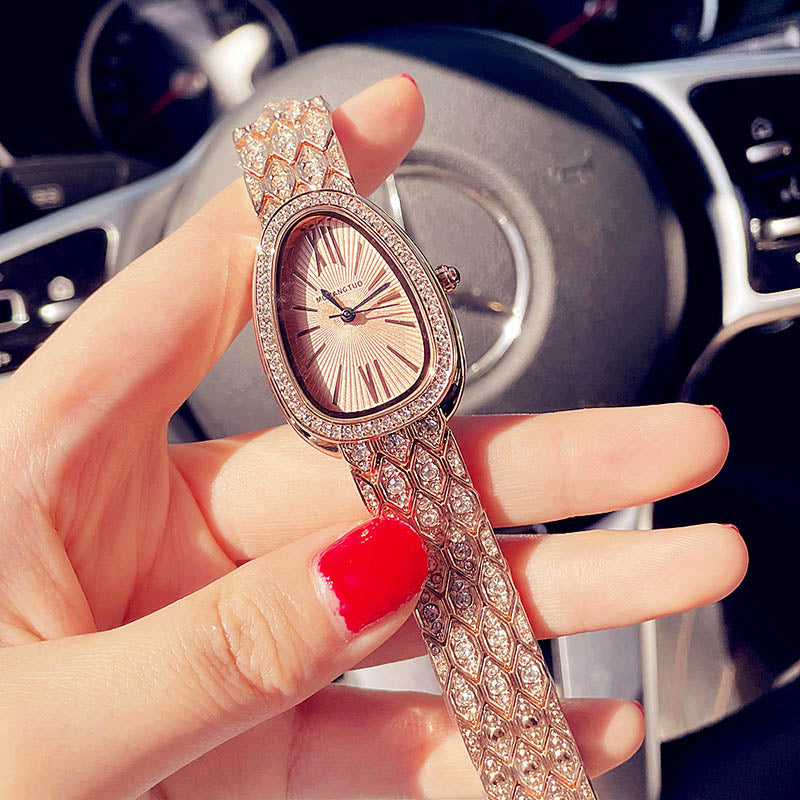 Rose gold snake egg watch
